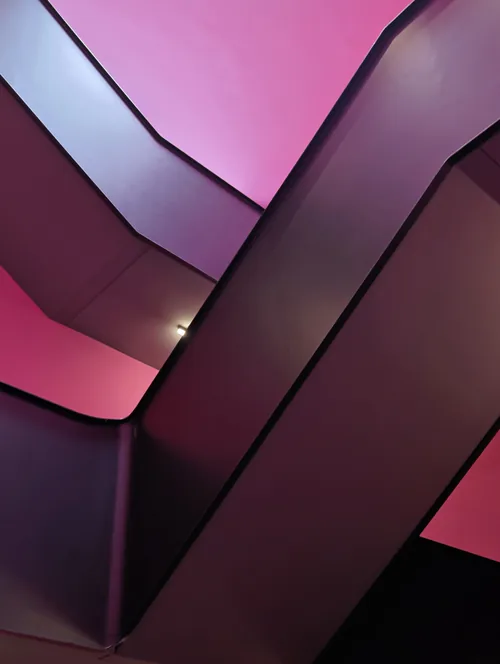 Pink and violet stair stringers crossing at sharp diagonals