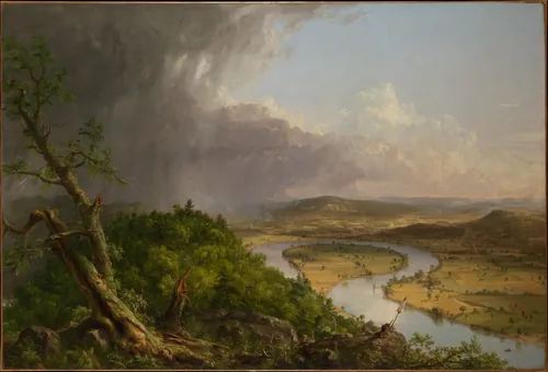 From a stormy wooded hilltop on the left, the view opens onto a sunlit valley where a river makes a wide loop through fields as the storm retreats.