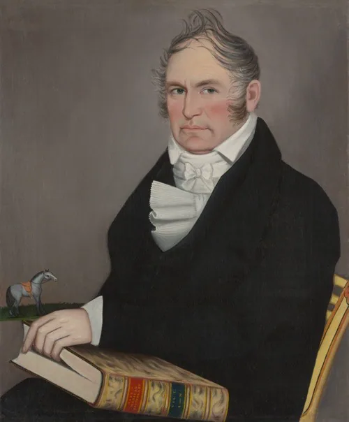 Portrait of man, black coat, white collar, hand in book.
