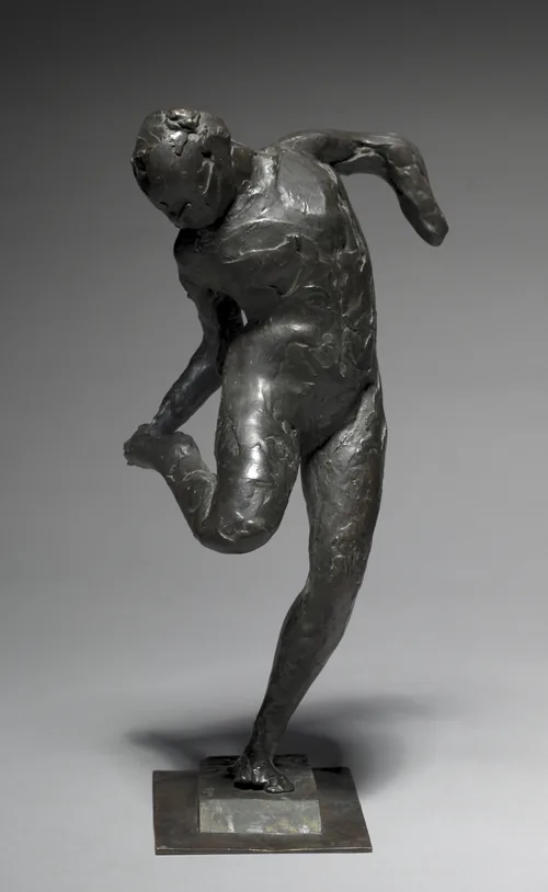 Dancer Looking at the Sole of her Right Foot