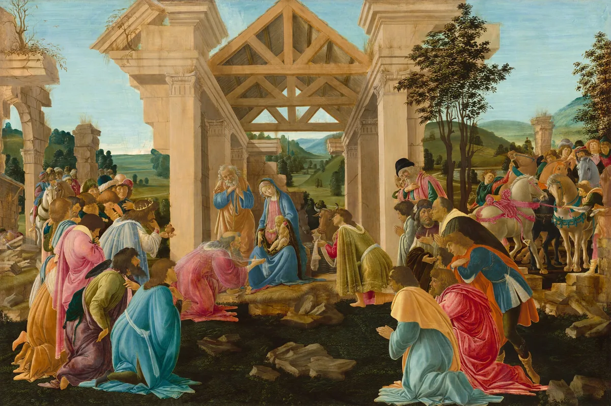 About three dozen people gather in a grassy field to either side of a crumbling structure to kneel and pray before a woman and baby in the center of this horizontal painting.
