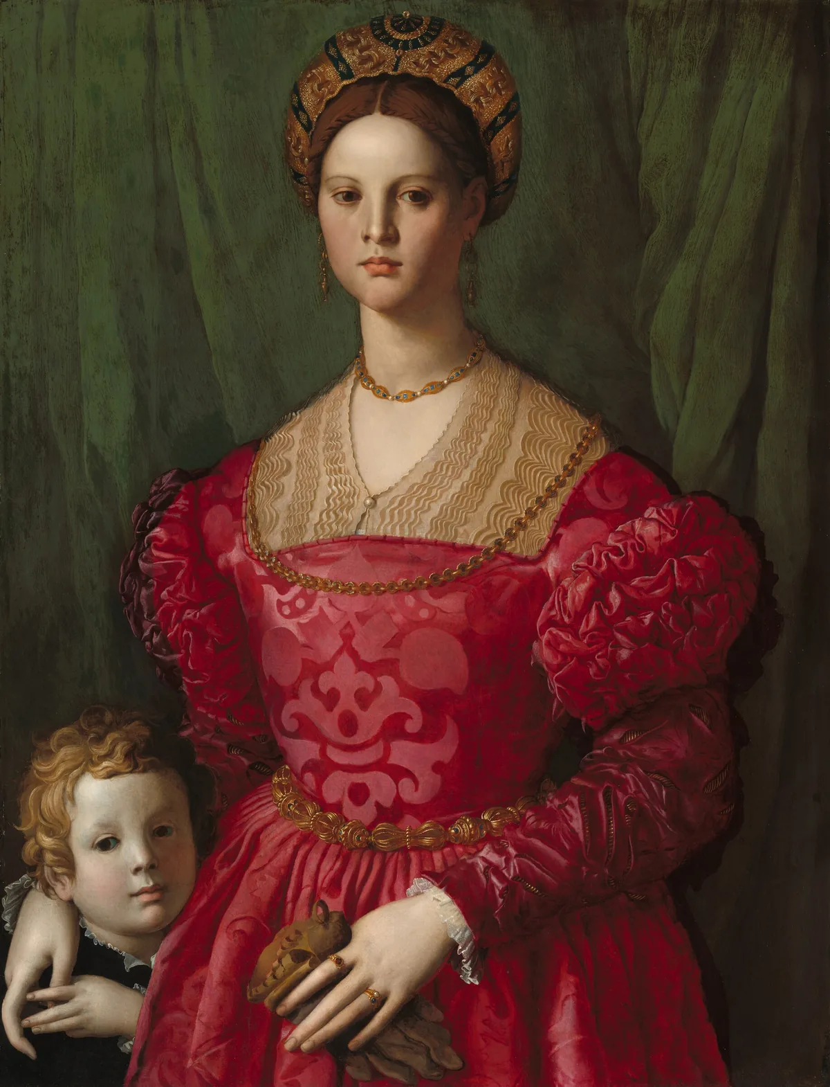 A woman wearing a crimson-red brocade dress and gold jewelry fills most of this vertical portrait, but her right hand, on our left, rests on the shoulder of a young boy tucked into the lower left corner of the panel.