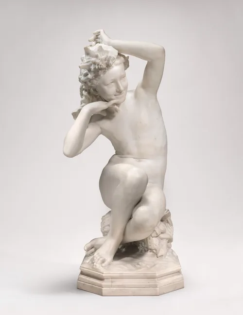 The sculpture depicts a young female figure in a seated position, with her legs crossed and her upper body leaning slightly to the left.
