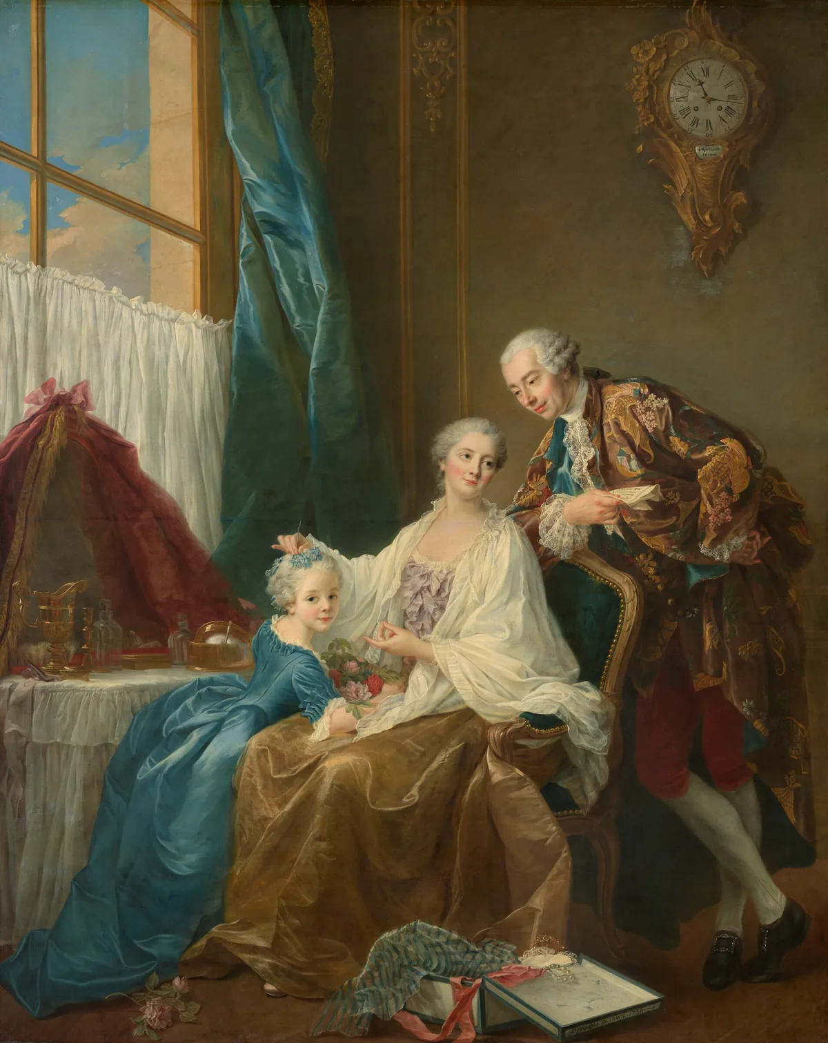 A woman sitting in an upholstered chair near a vanity table touches the hair of the little girl leaning against her lap to our left, as a man leans onto the back of her chair to our right in this vertical portrait painting.