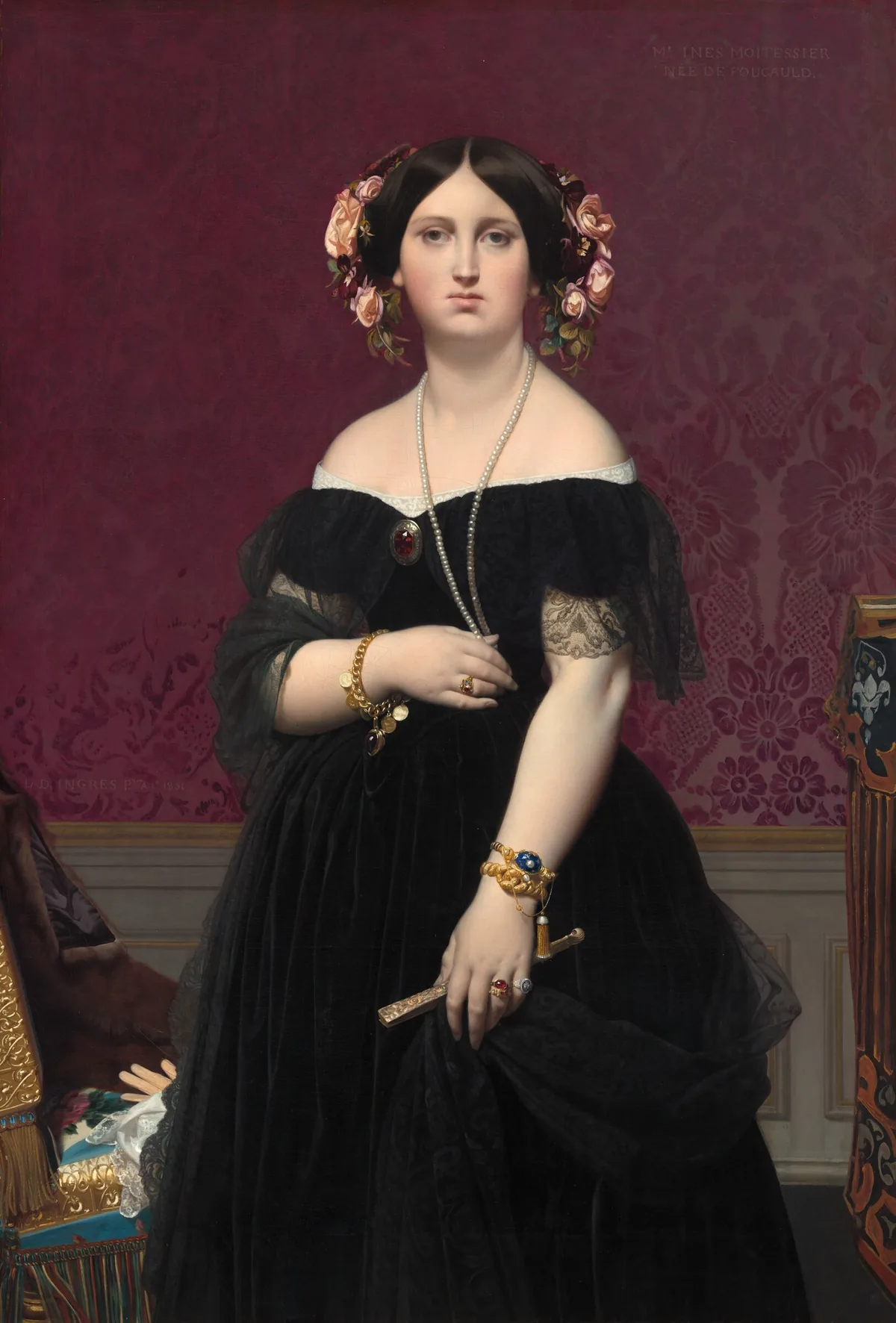 Shown from the knees up, a pale-skinned woman wearing an off-the-shoulder, black gown stands in front of a maroon-red wall in this vertical portrait painting.