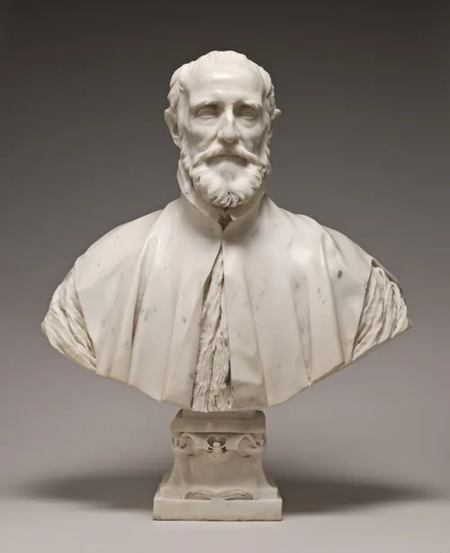 This free-standing, white marble sculpture shows the head, shoulders, and upper chest of a balding, bearded man.
