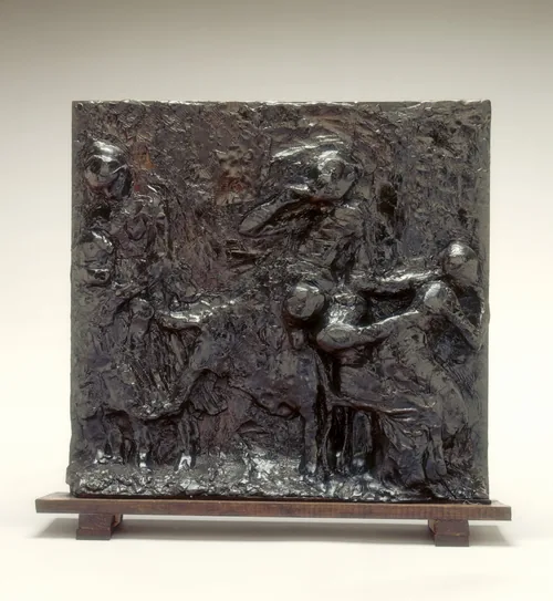 The image shows a relief panel with multiple human figures in dynamic poses.