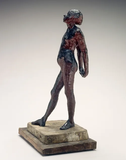 A young, nude girl is roughly modeled with glossy navy blue and wine-red beeswax in this freestanding sculpture.
