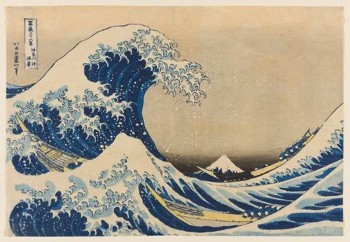 A color woodblock print of a large crashing wave, looms over two narrow boats full of people. Mt Fuji in the background.  There is a faint peach colored sky.