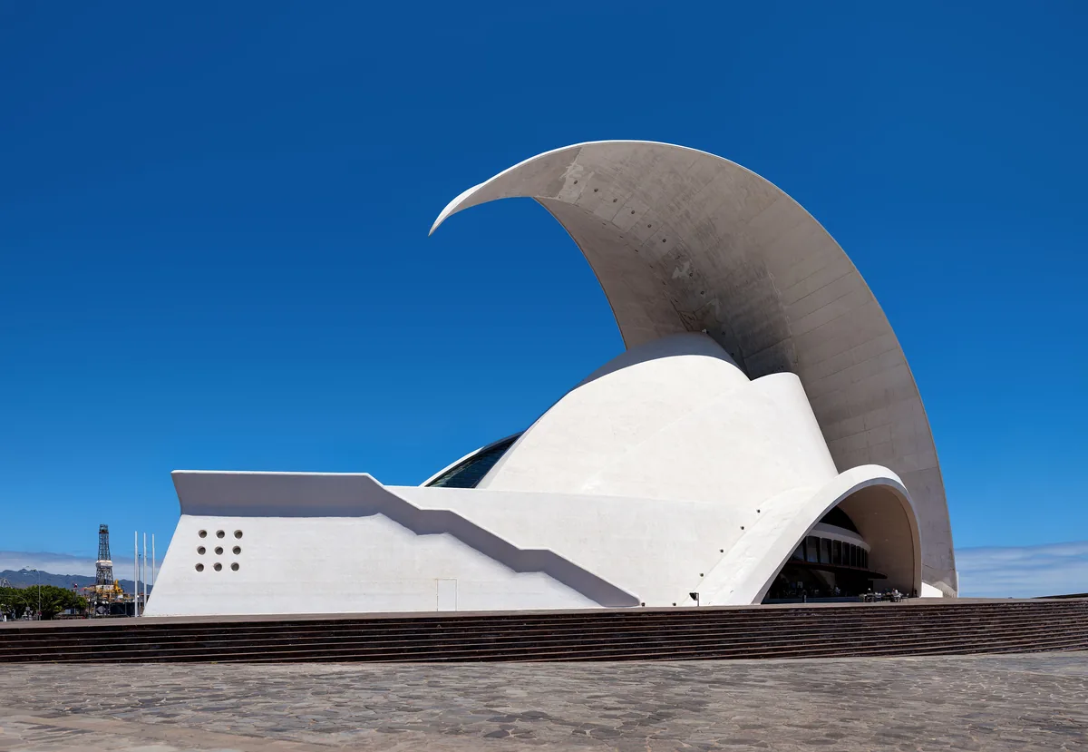 The cresting concrete wave of the Auditorio de Tenerife above the Atlantic shore.