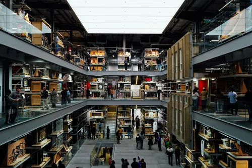 Open storage at the V&A East Storehouse, thousands of objects visible on catwalks between the shelves.